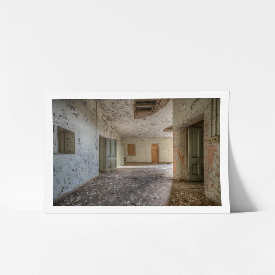 Upstairs Ward at Female Ward 9 & 10, paint peels from every surface in wide, brittle curls.