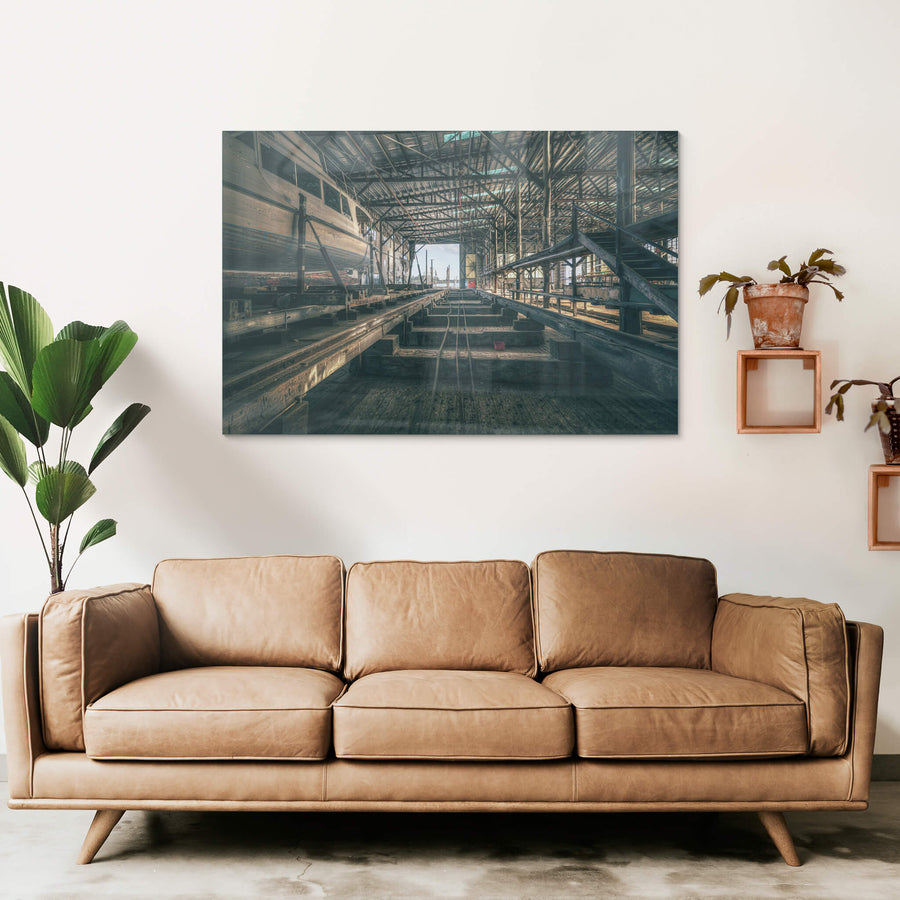 Sleeper Row at Halvorsens Boat Yard, heavy timber sleepers run in parallel lines down the centre of the shed, steel cables.