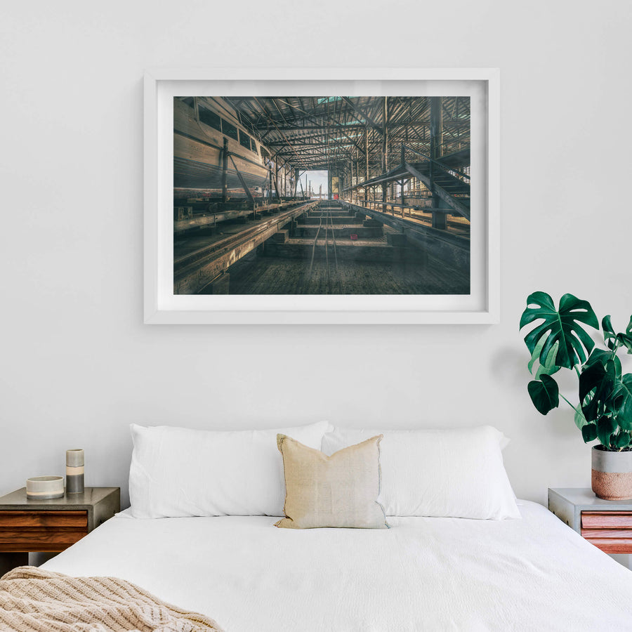 Sleeper Row at Halvorsens Boat Yard, heavy timber sleepers run in parallel lines down the centre of the shed, steel cables.