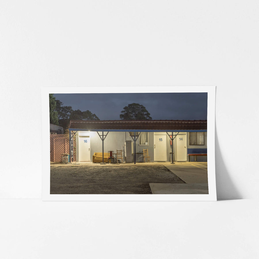 Appin Motel at Hotel Motel 101, a single security light burns above room 16, throwing hard white light across the concrete.