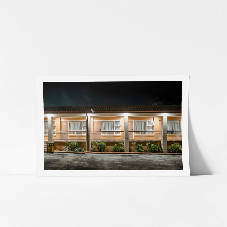 Engadine Motor Inn at Hotel Motel 101, peach-coloured render and concrete pillars divide the facade into identical bays.