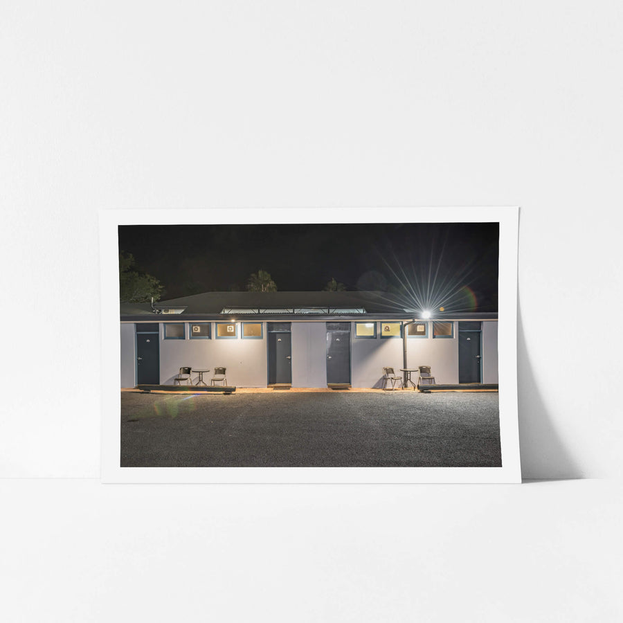The Colonial Motel at Hotel Motel 101, a single-storey motel block sits flat against the night.
