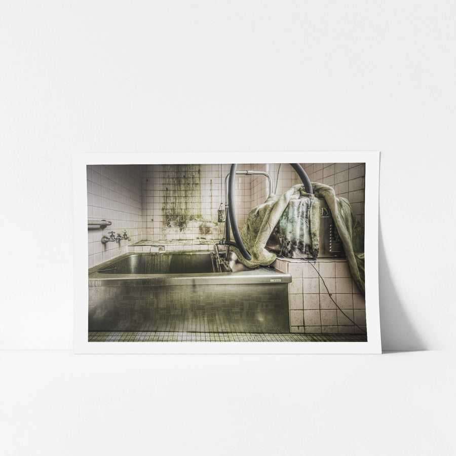 Bath at Kuwashima Hospital, a stainless steel hydrotherapy bath sits recessed into a tiled platform.