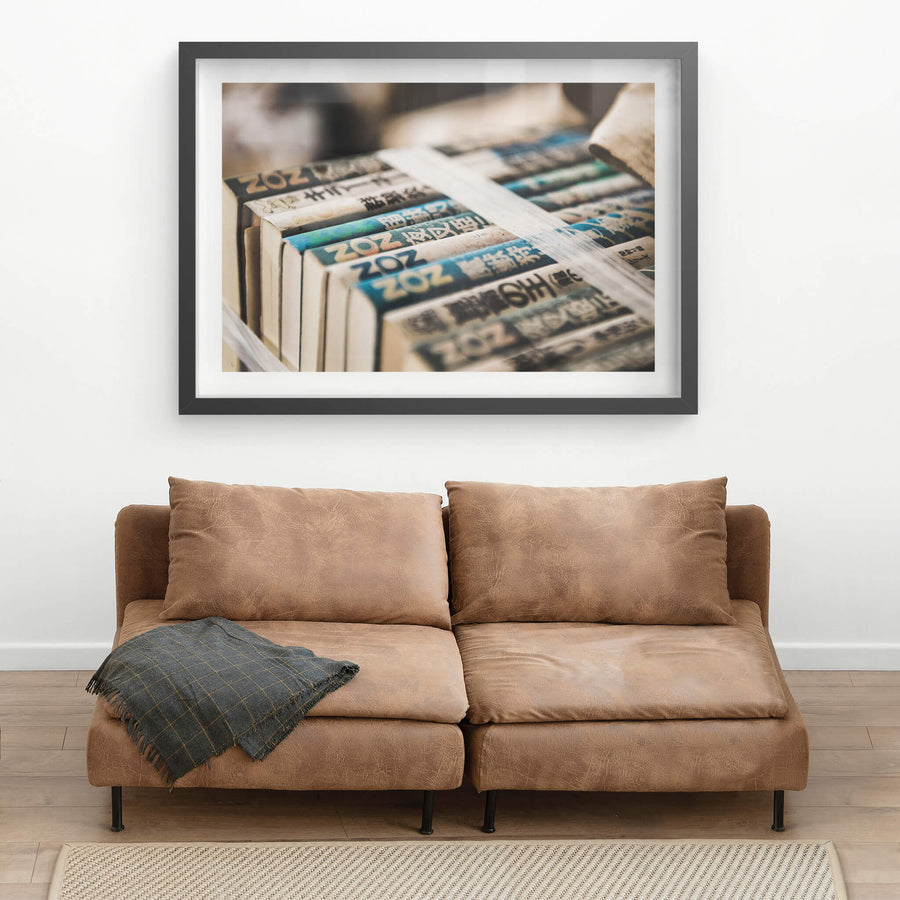 Books at Kuwashima Hospital, a bundle of Japanese paperbacks sits tightly bound with packing tape.