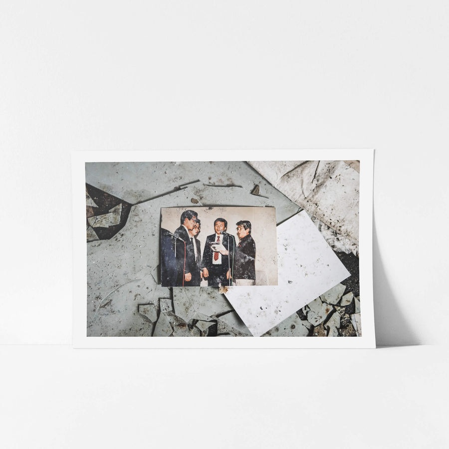 Karaoke Night at Kuwashima Hospital, a colour photograph lies face-up on a floor of shattered tiles.
