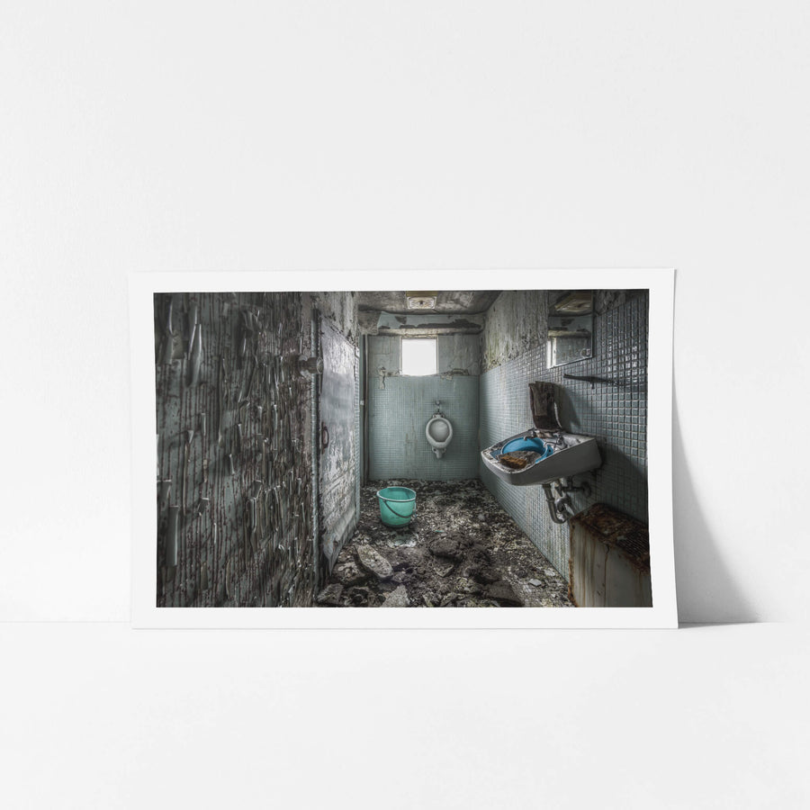 Toilet at Kuwashima Hospital, small blue-green mosaic tiles line the walls of a narrow washroom.