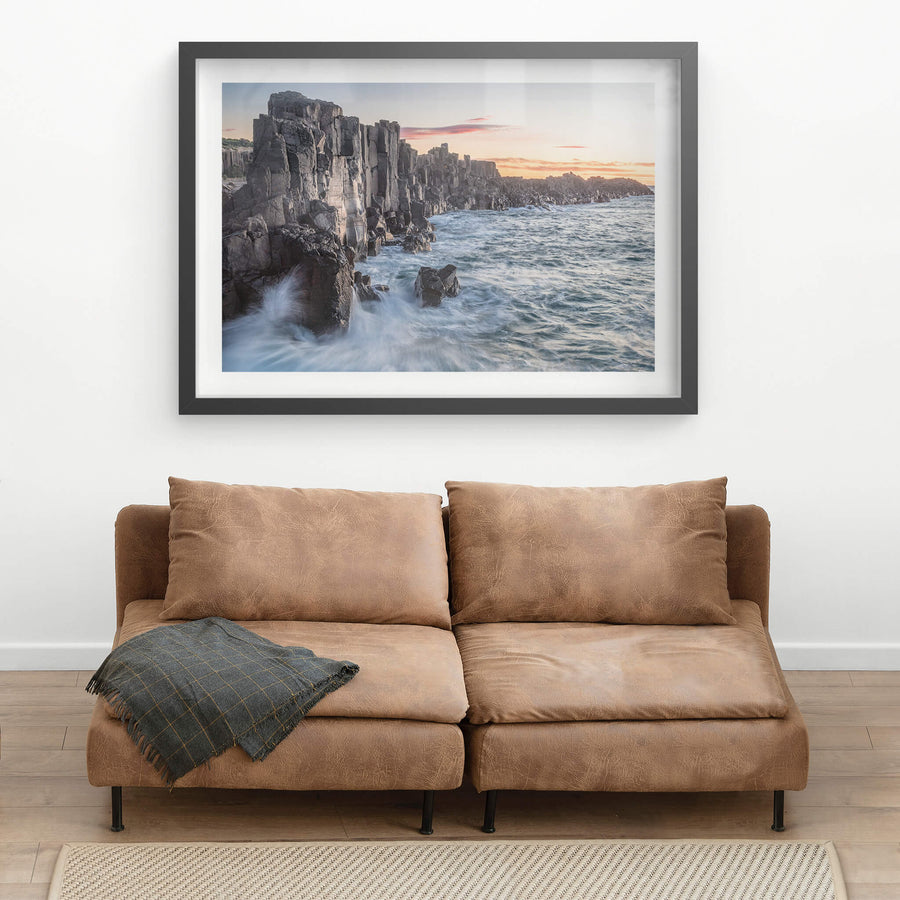 Bombo Quarry at Landscapes, waves crashing against the rocks at sunrise.