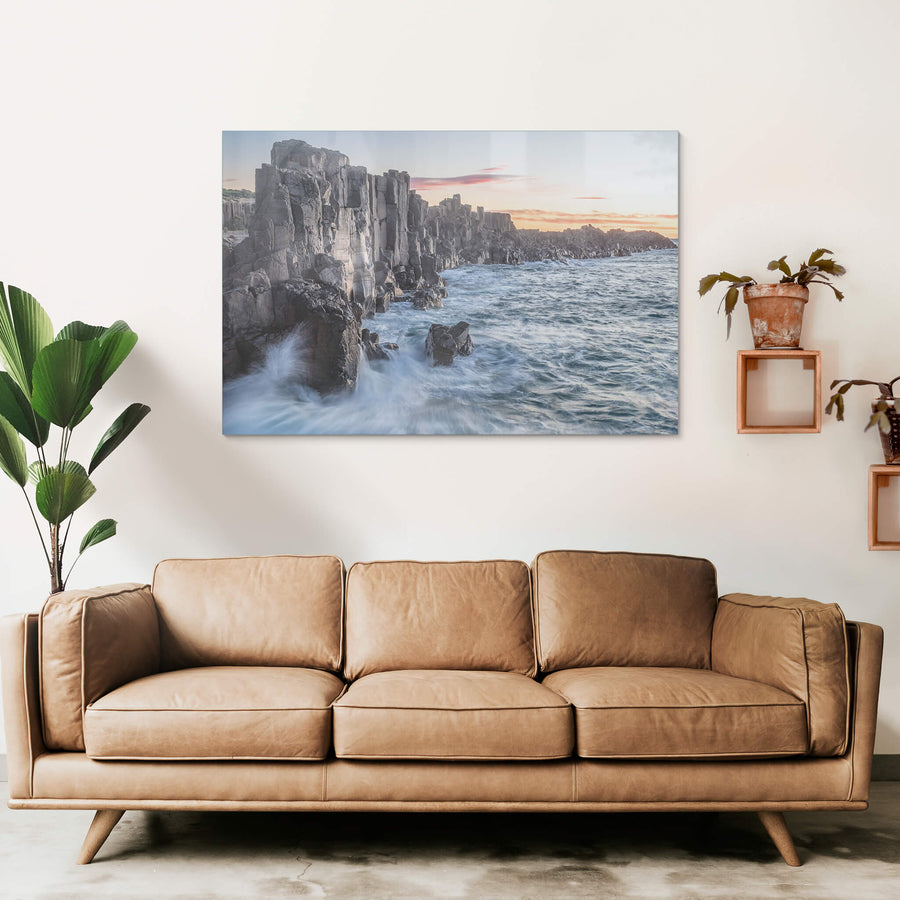 Bombo Quarry at Landscapes, waves crashing against the rocks at sunrise.
