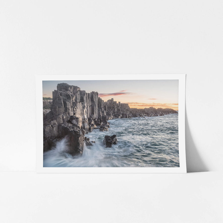 Bombo Quarry at Landscapes, waves crashing against the rocks at sunrise.