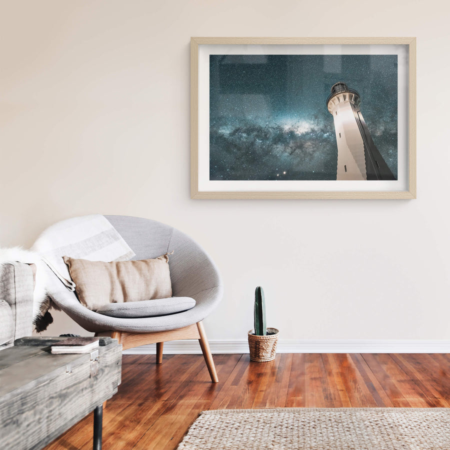 Green Cape Lighthouse at Landscapes, the white-painted tower rises from below, its tapered column filling the frame against.