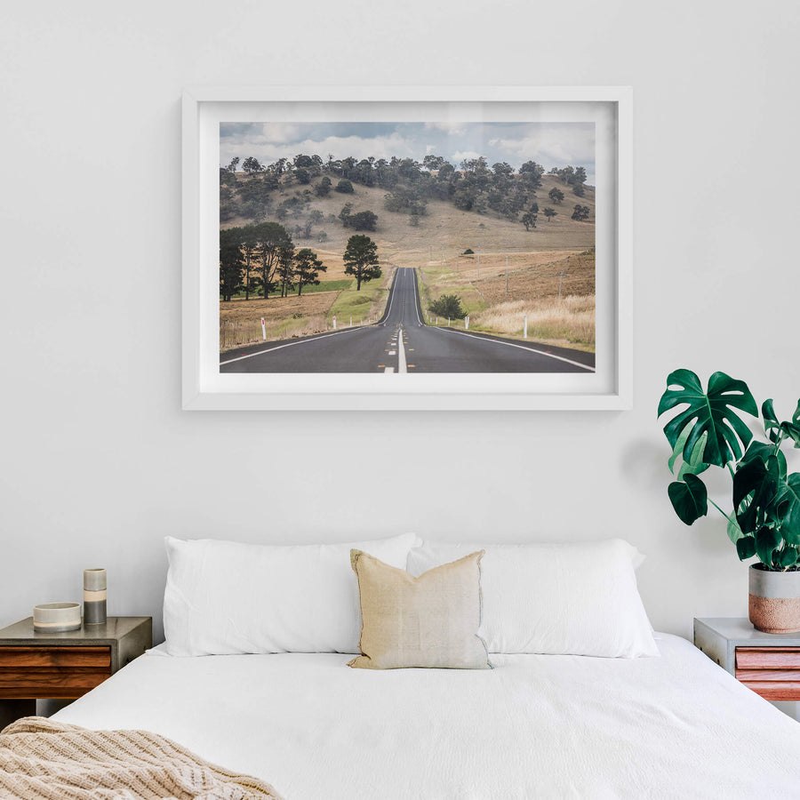 Monaro Highway at Landscapes, a road that rises and falls with the land, carving a path through the rolling hills.