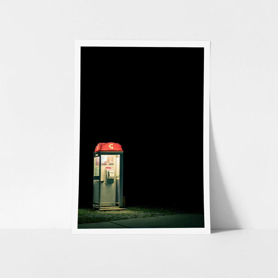 Night Call at Landscapes, a Telstra payphone stands alone at the edge of a roadside verge.