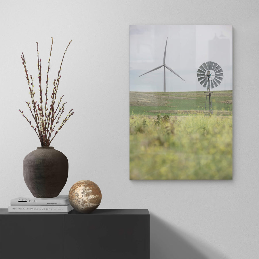 What Came Before at Landscapes, a galvanised multi-blade windmill stands on a steel lattice tower in the foreground.