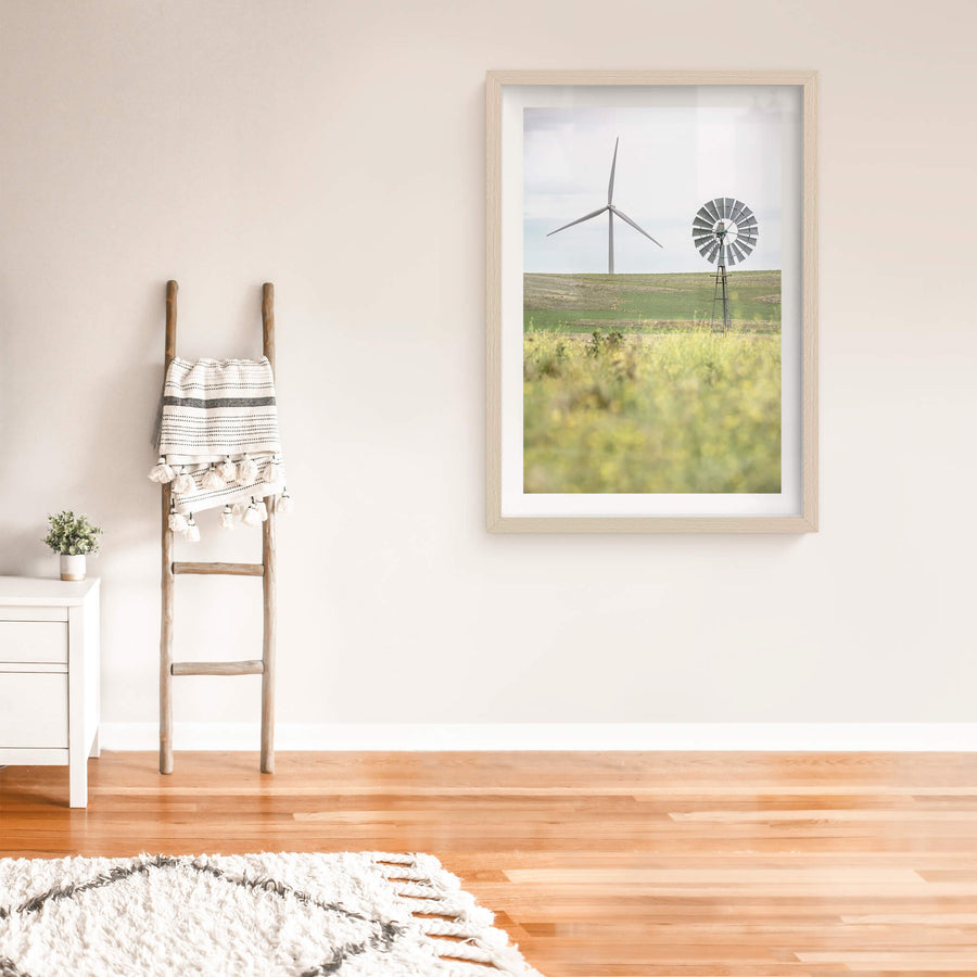 What Came Before at Landscapes, a galvanised multi-blade windmill stands on a steel lattice tower in the foreground.