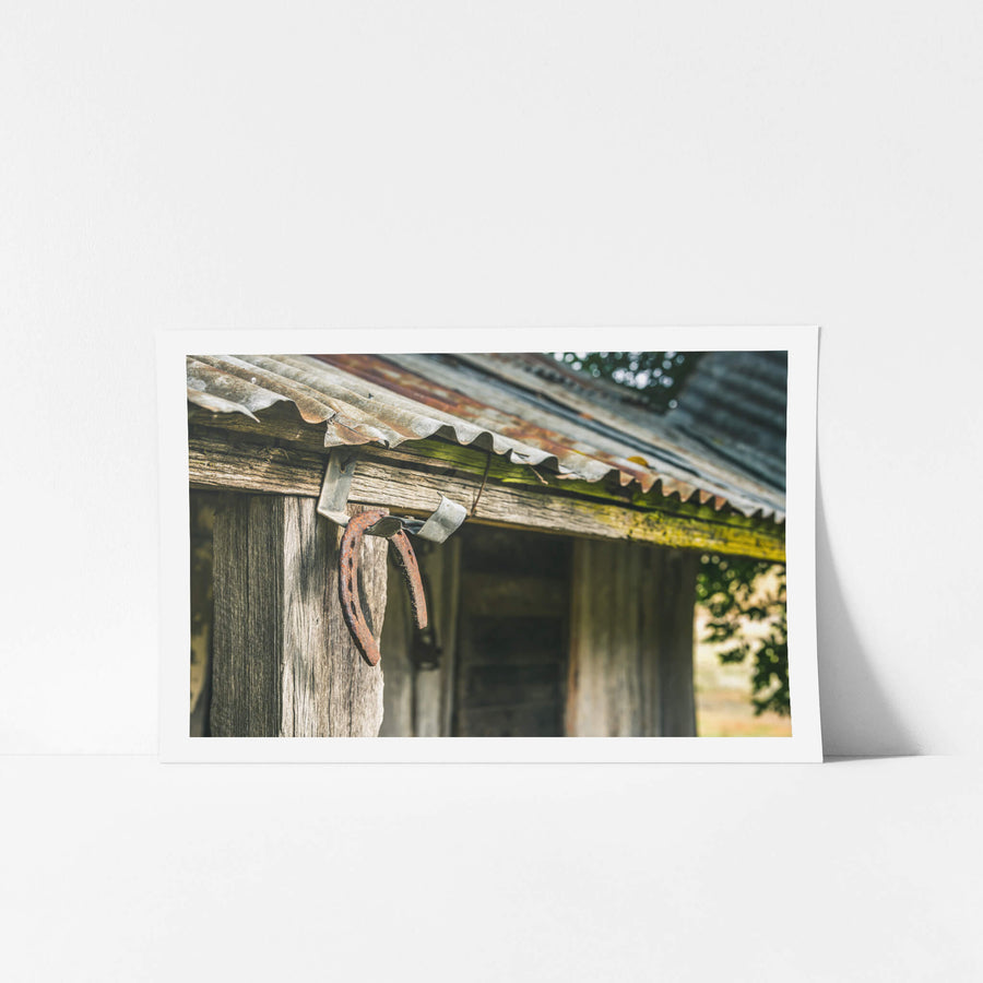 Horseshoe at Leichhardt House, two rusted horseshoes hang from a bent nail on a hardwood post.