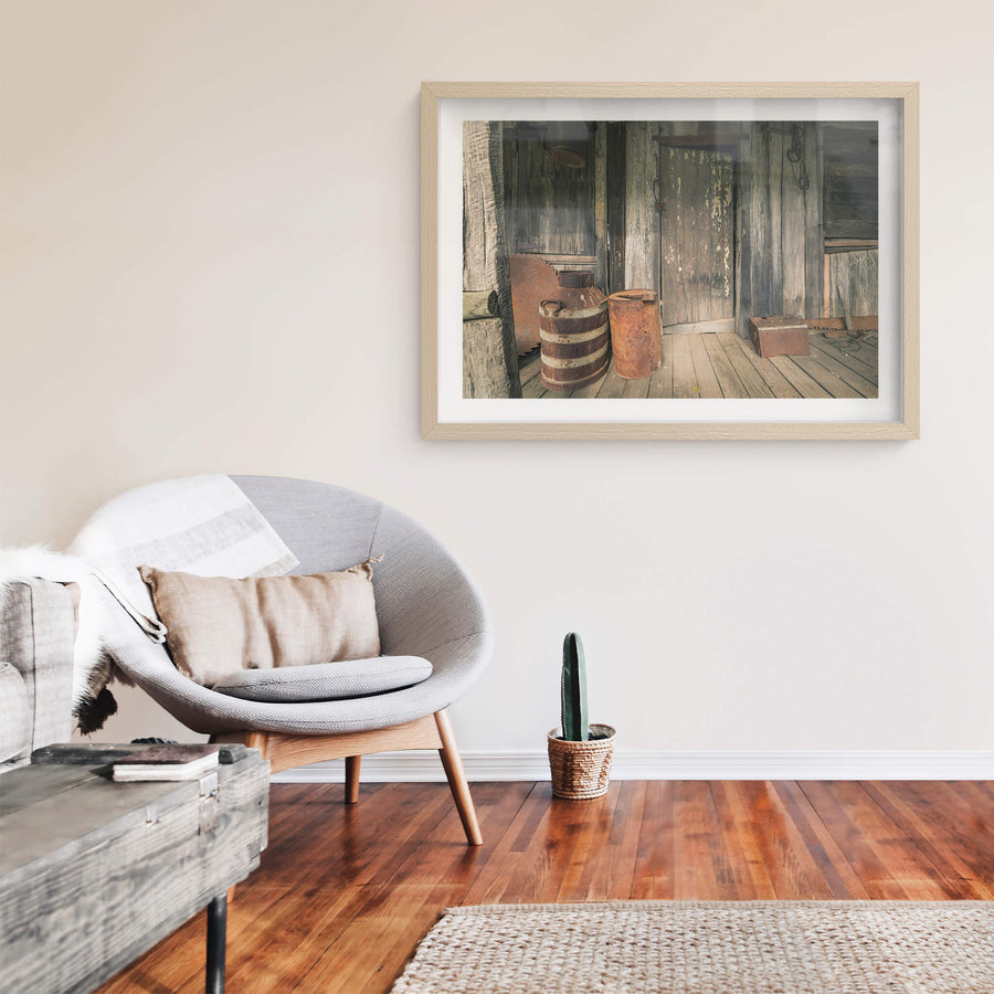 Porch at Leichhardt House, a covered timber verandah, grey and split with age.