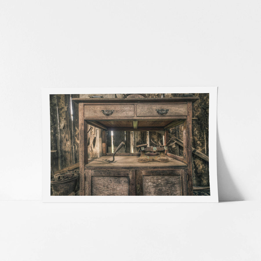 Scales at Leichhardt House, a hardwood washstand sits against a wall of peeling bark and rough-sawn timber.