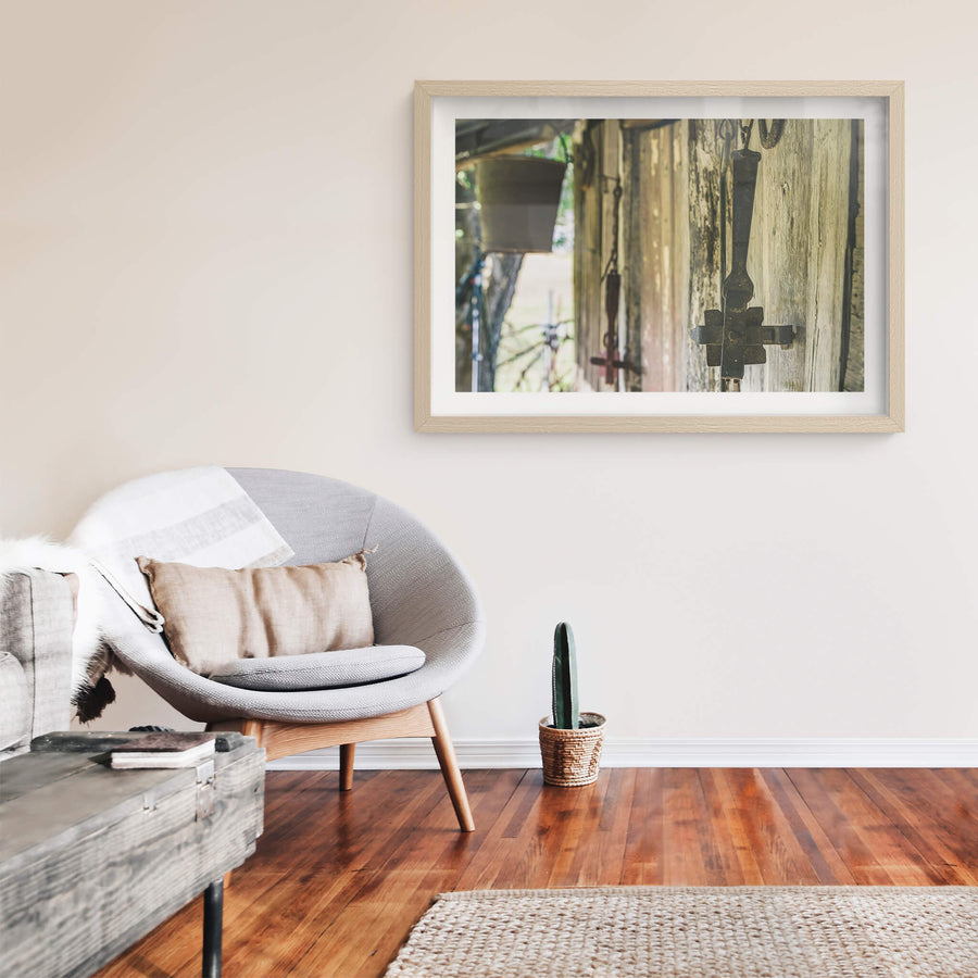 Traps at Leichhardt House, cast iron branding irons hang from hooks driven into weathered hardwood cladding.