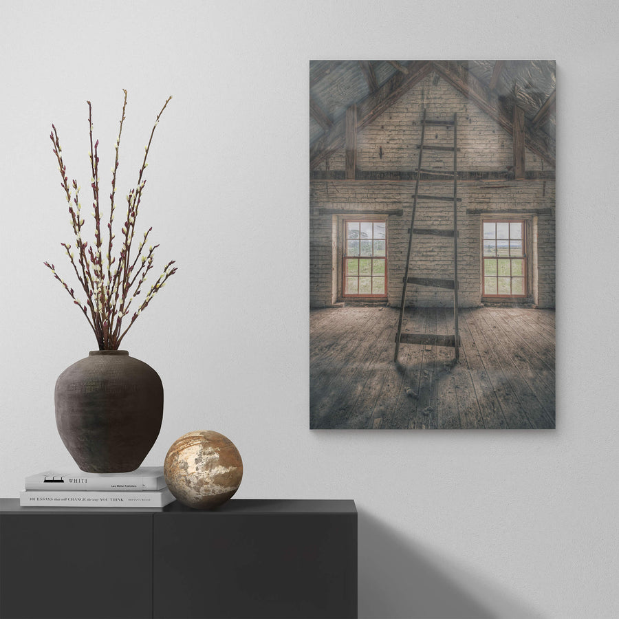 Top of the Mill at Mill Pond Farm, a timber ladder leans against the gable wall, its rungs cracked and splintered.