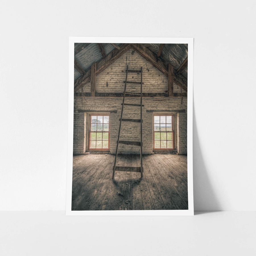 Top of the Mill at Mill Pond Farm, a timber ladder leans against the gable wall, its rungs cracked and splintered.