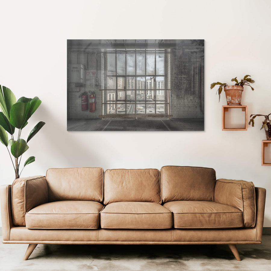 B to A at Morwell Power Station, a steel-framed window stretches floor to ceiling, divided into a grid of thick panes.