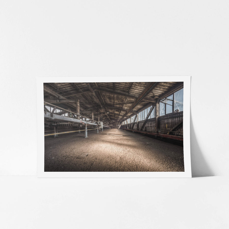 M50s at Morwell Power Station, a long covered conveyor gallery stretches into the distance, its timber-lined roof darkened.