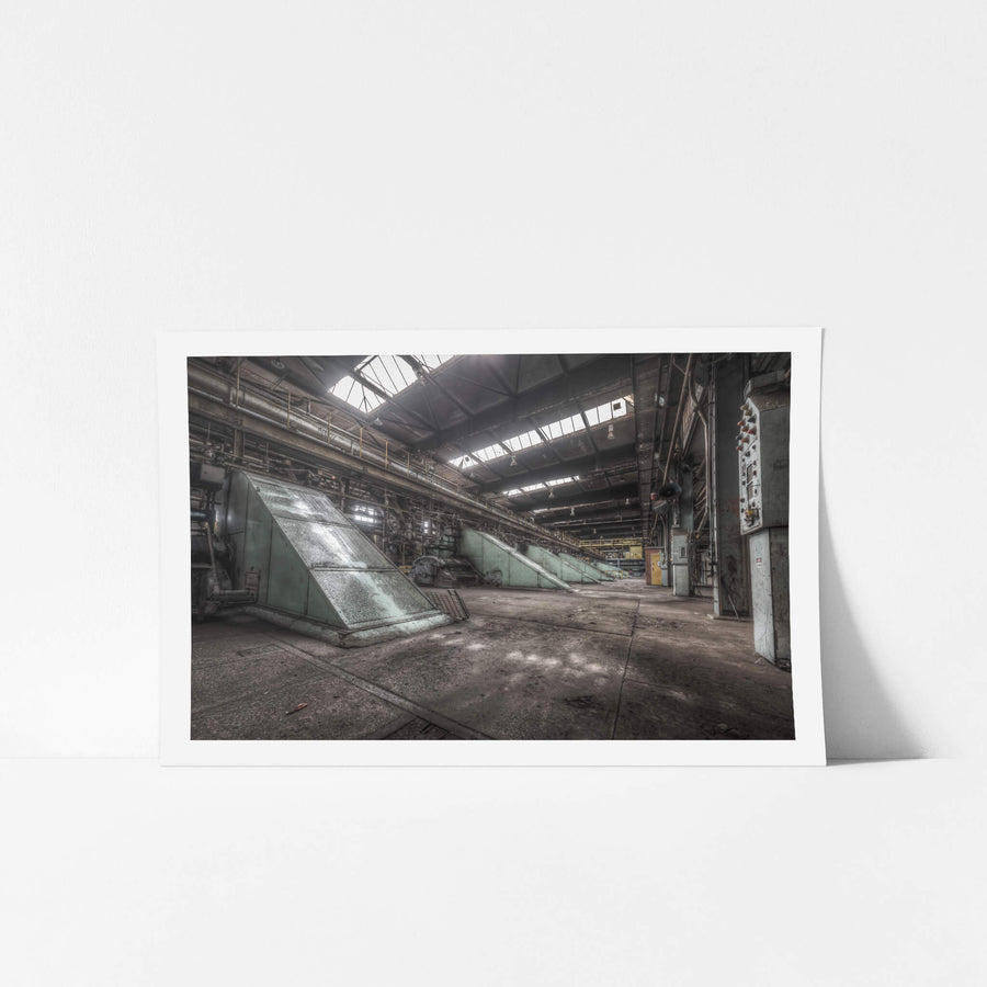 Main Press Floor at Morwell Power Station, large green steel housings sit at sharp angles along the concrete floor.