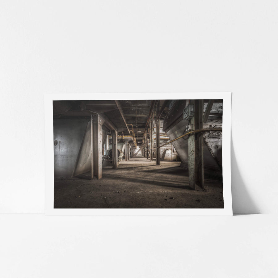 Screen Floor at Morwell Power Station, steel hoppers line both sides of a narrow corridor, their conical bases suspended.