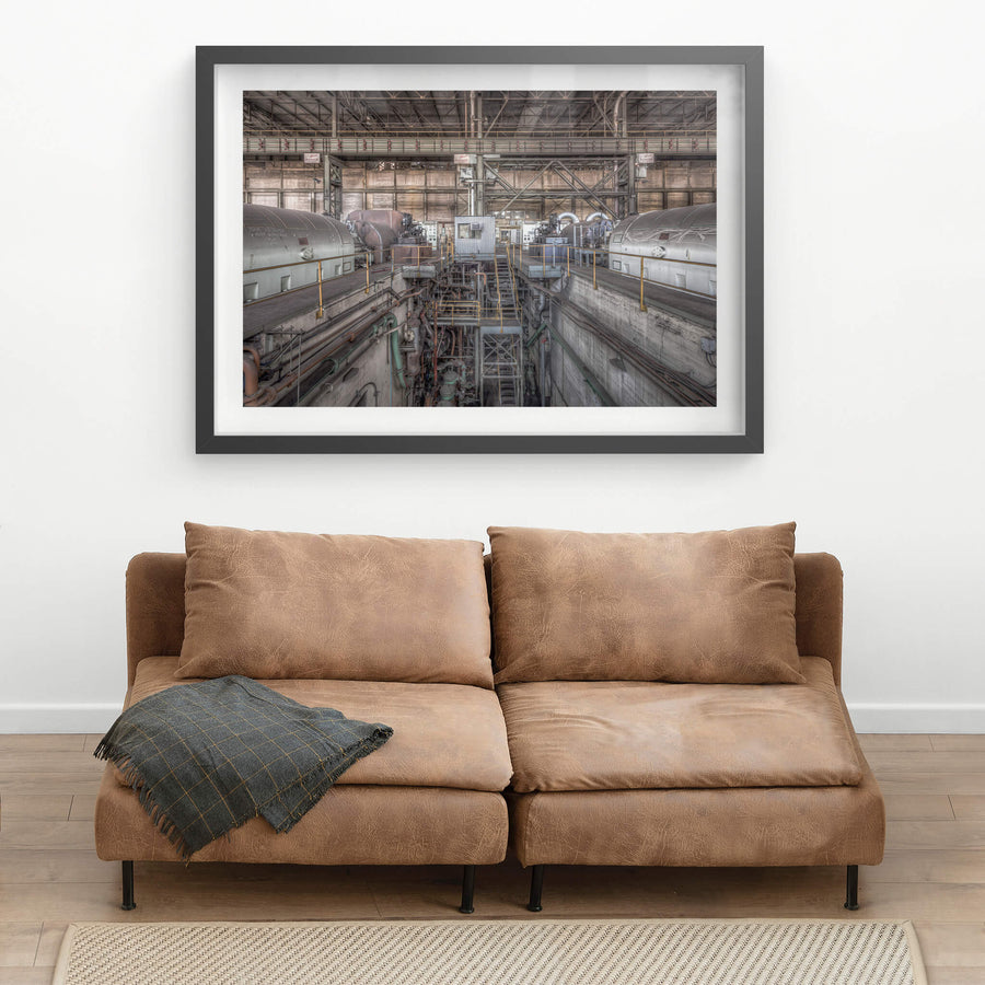 Turbine Floor at Morwell Power Station, four turbo-alternator units sit in two rows, their cylindrical steel casings grey.