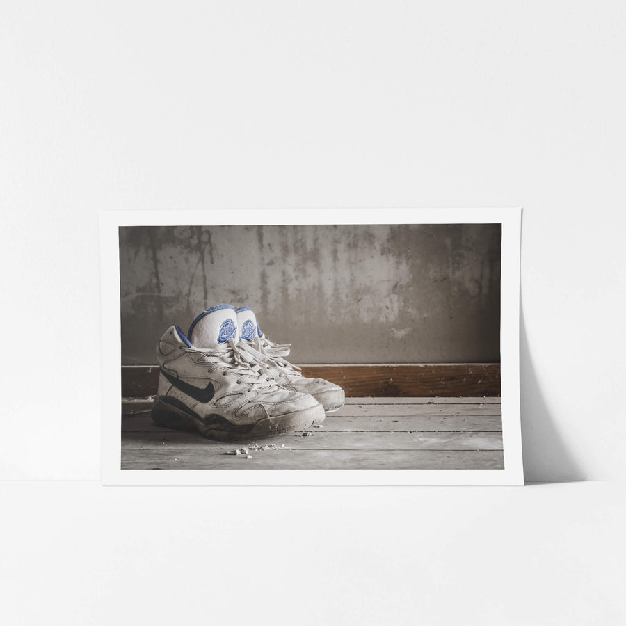Nike Air at Nichitsu Mining Village, a pair of white leather Nike high-tops sit on grey timber floorboards.