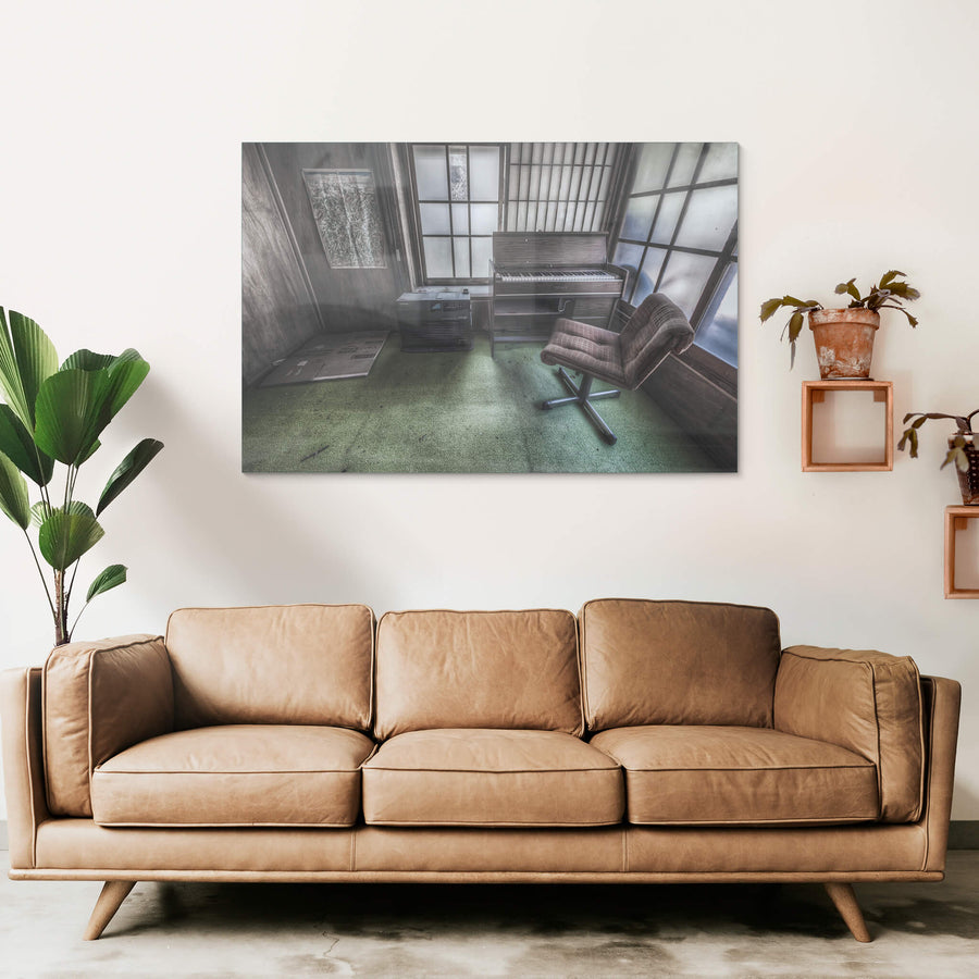 Studio at Nichitsu Mining Village, a plaid swivel chair faces a compact electric organ in the corner of a small.