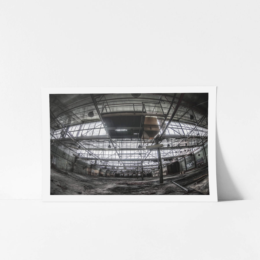 Closures Floor at O-I Glass, steel trusses span the full width of the closures floor, crossing high above a concrete slab.