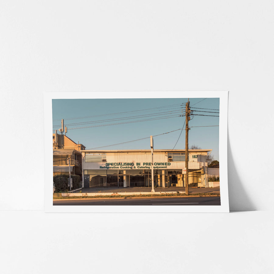 167 at Parramatta Road, a two-storey commercial building sits hard against Parramatta Road.
