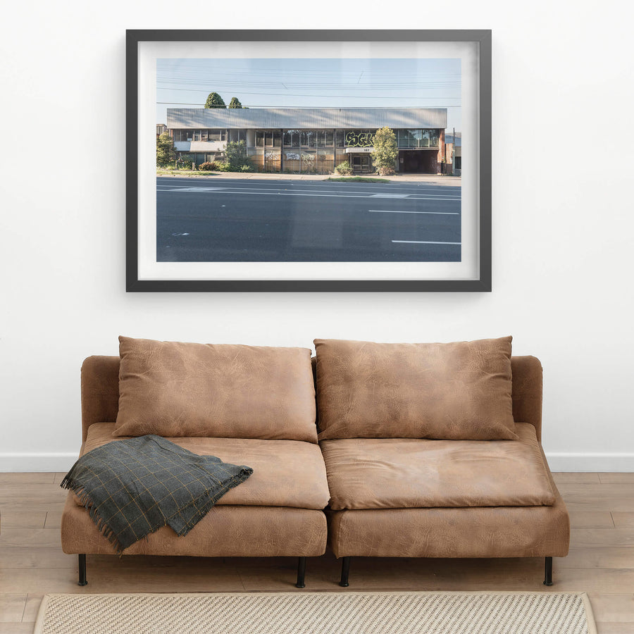 187 at Parramatta Road, a two-storey commercial building sits hard against Parramatta Road.