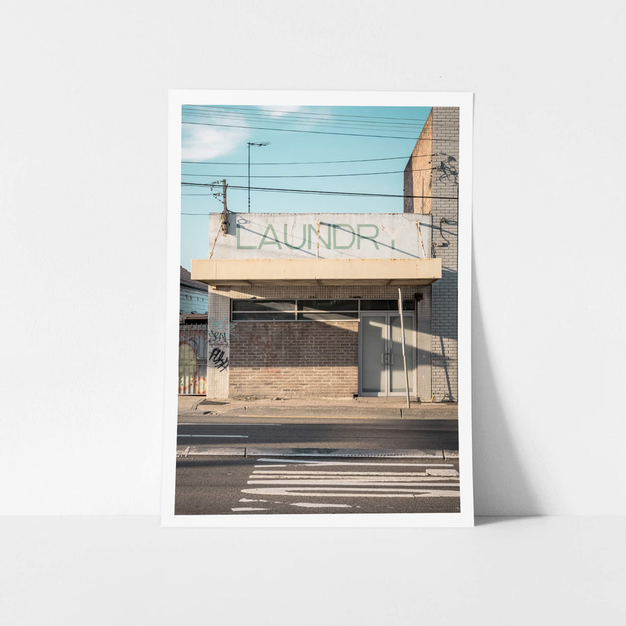 Laundry at Parramatta Road, something about its stark frontage, the faded lettering, and the complete absence of visible.