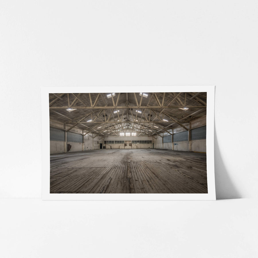 Annex at Portland Cement Works, steel roof trusses span the full width of the building, their web of angled braces.