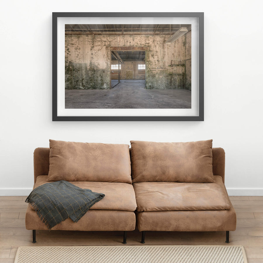 Blacksmith To Electrical Workshops at Portland Cement Works, a wide doorway cuts through a thick brick wall, connecting two.
