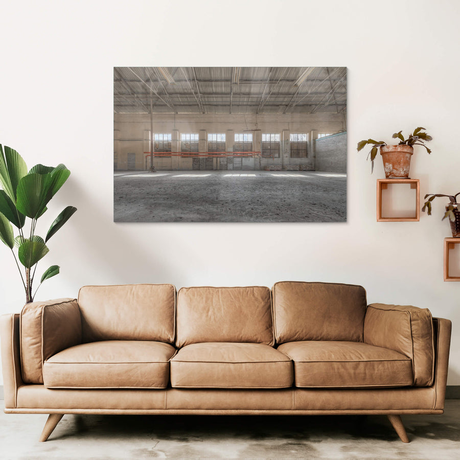 Cross Machine Shop at Portland Cement Works, a wide industrial floor stretches towards a row of steel-framed windows.