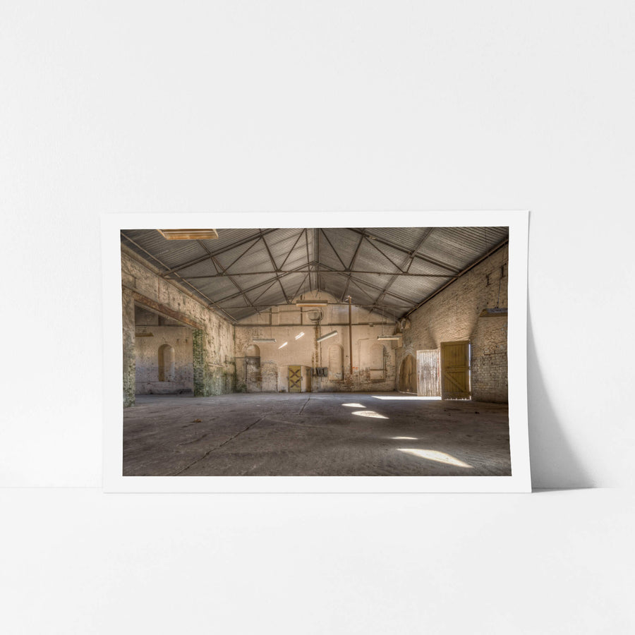 Electrical Workshop at Portland Cement Works, steel roof trusses span the full width of the workshop, supported by thick.