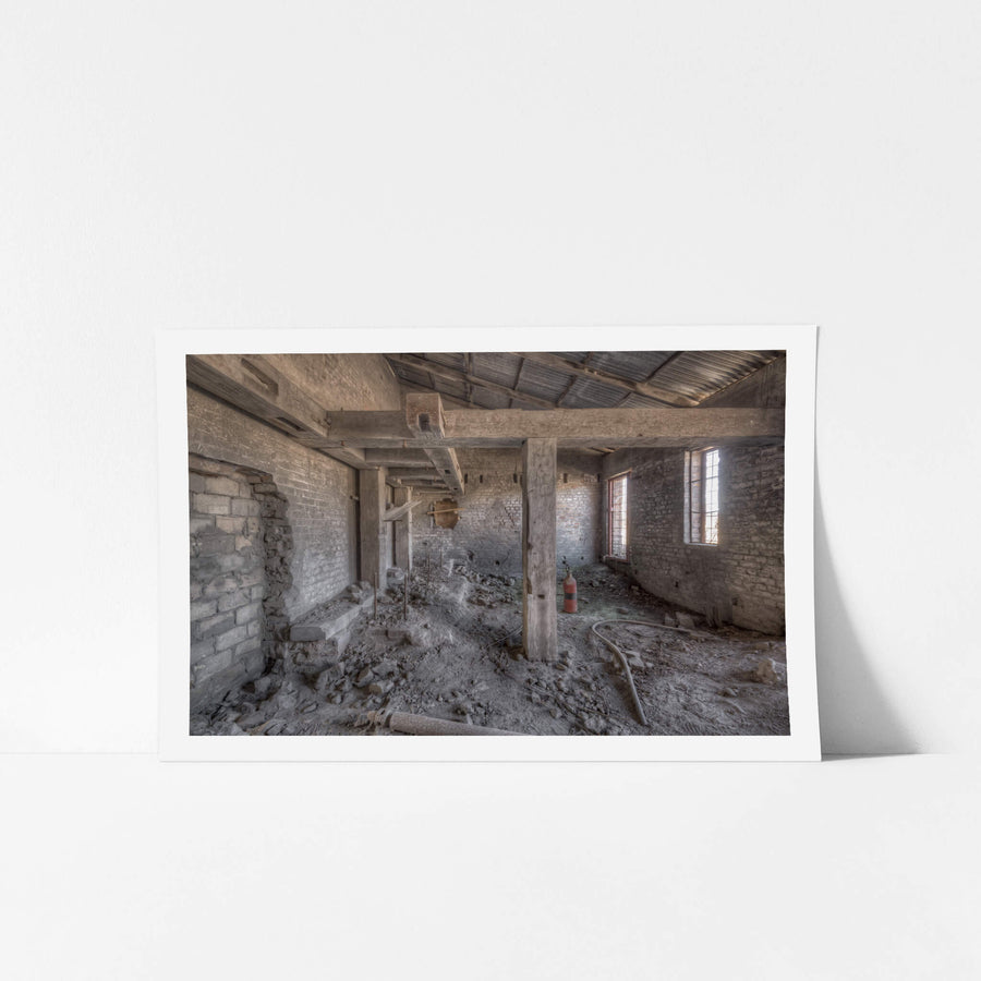 Raffan Mill Boiler House at Portland Cement Works, heavy timber posts rise from a floor buried in rubble and powdered morite.