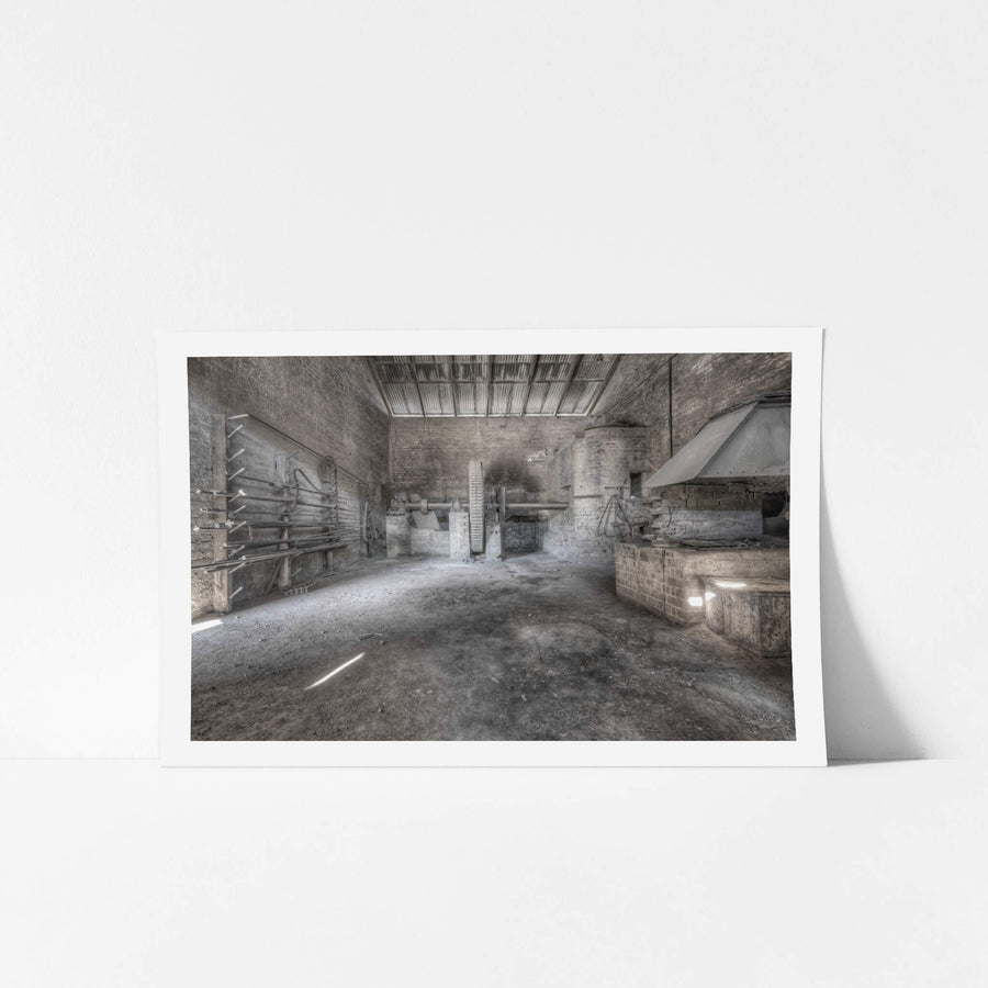 Raffan Mill at Portland Cement Works, bare brick walls rise to a corrugated iron roof inside one of the mill buildings.