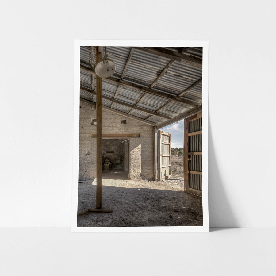 Raffan Mill Workshop at Portland Cement Works, a corrugated iron roof spans the workshop on rough-hewn timber beams.