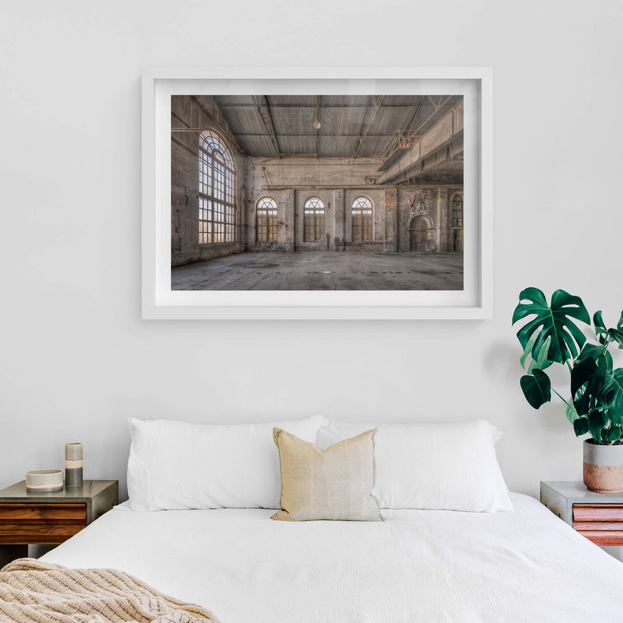 Small Arches at Portland Cement Works, three arched windows line the far wall, their semi-circular fanlights filtering pale.
