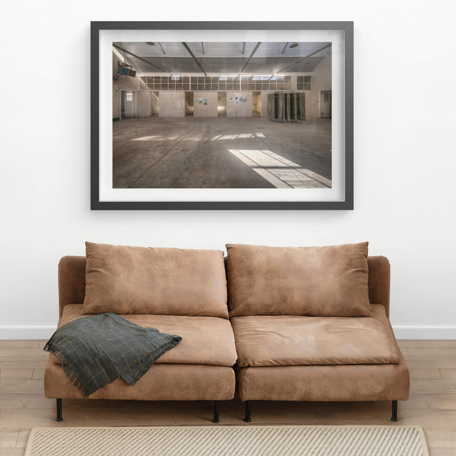 Wash House at Portland Cement Works, sunlight falls in clean geometric shapes across a concrete floor.