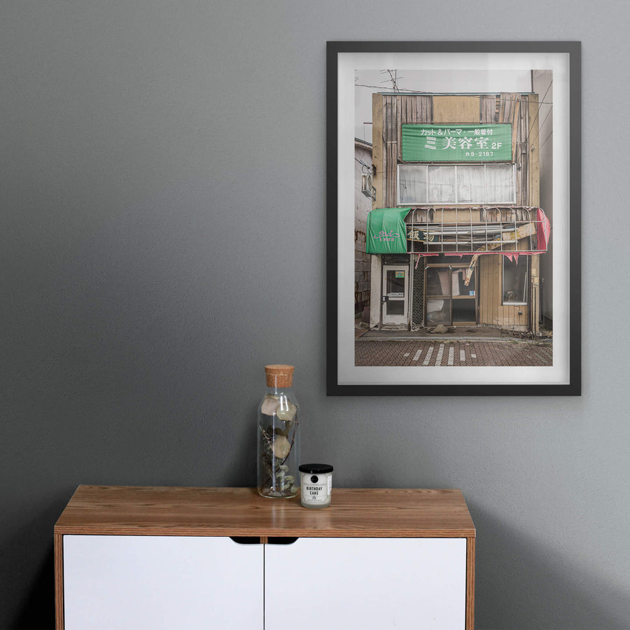 Shopfront at Streetscapes of Yubari, a two-storey shopfront on a quiet Yubari street.