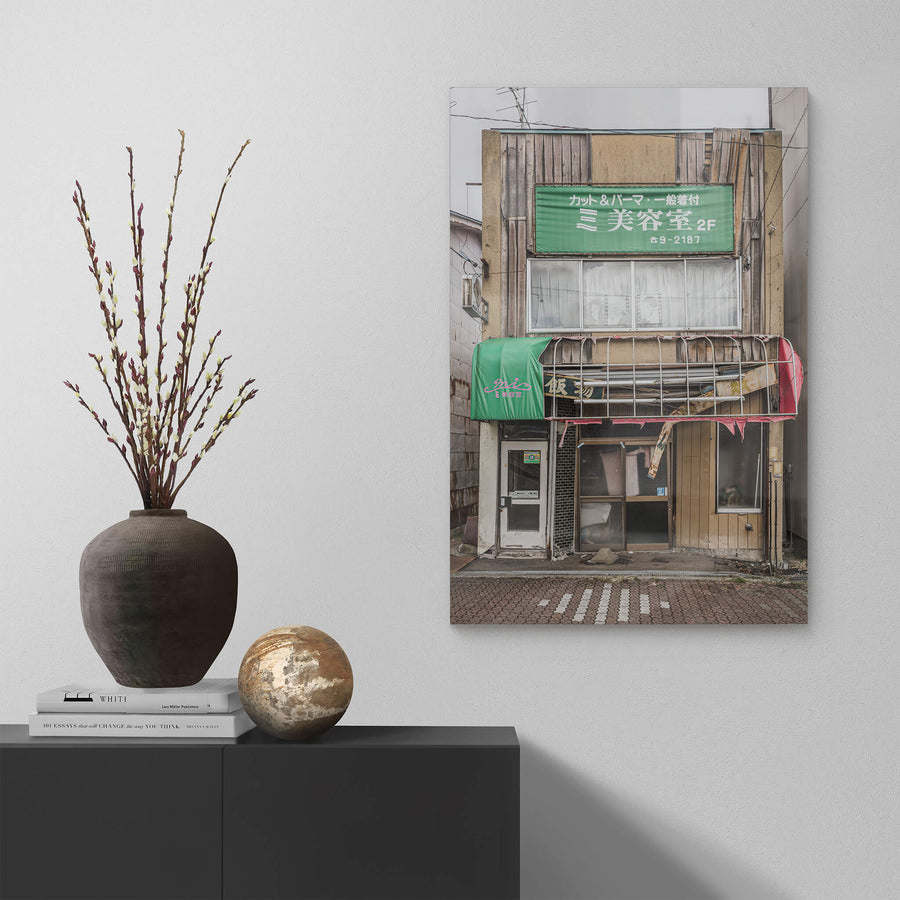 Shopfront at Streetscapes of Yubari, a two-storey shopfront on a quiet Yubari street.