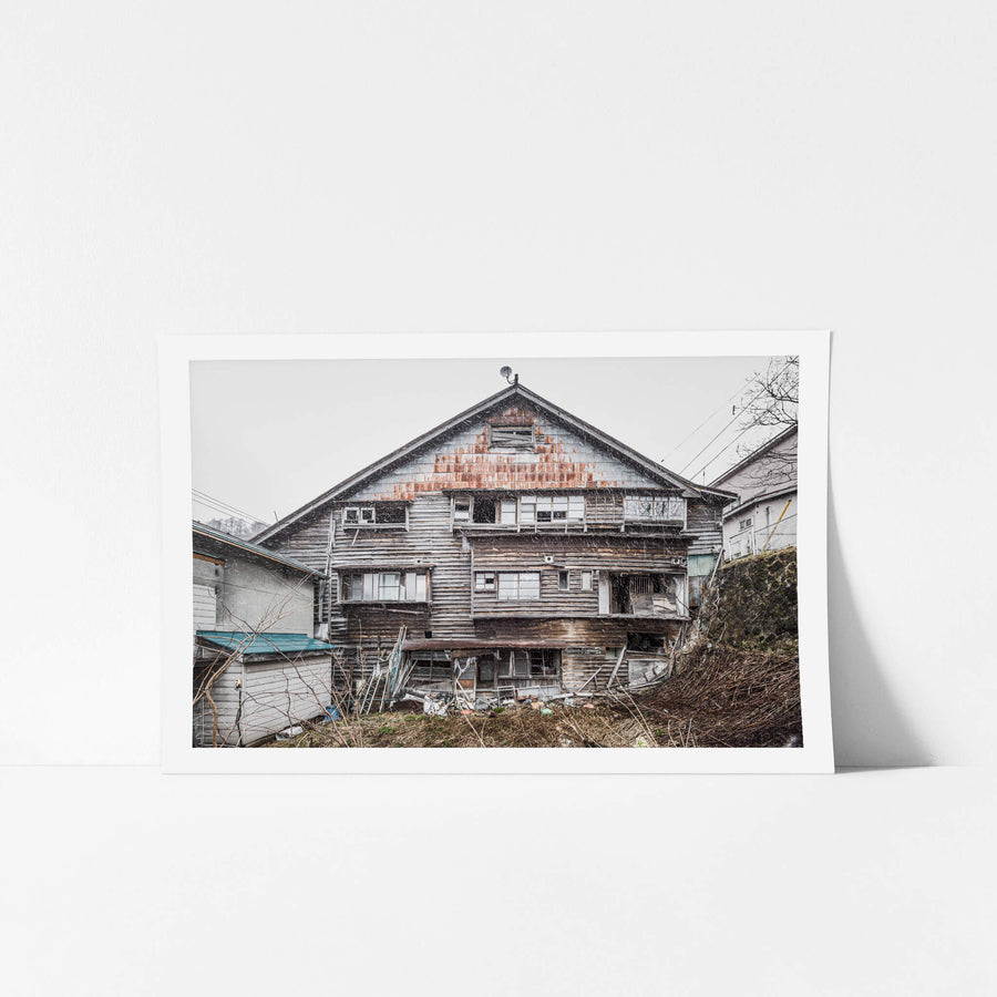 Side Facade at Streetscapes of Yubari, a shot from the side if an unstable building which would have once been a busy.