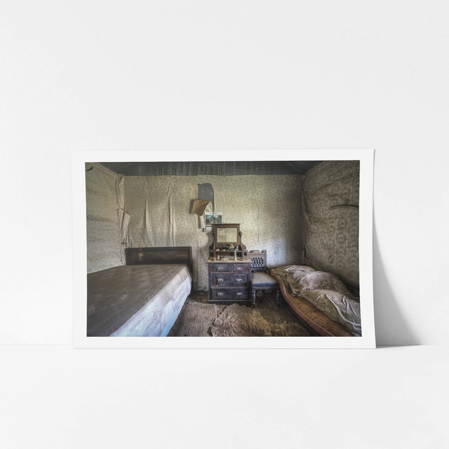 Side Bedroom at Woolla, two single beds fill the room, pushed against opposite walls with a timber dresser wedged.
