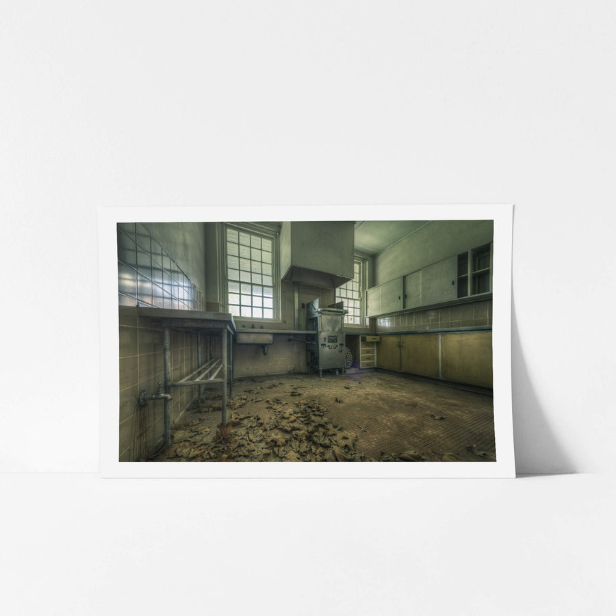 Cleaning Kitchen at The Asylum, dead leaves cover the tiled floor in thick drifts.