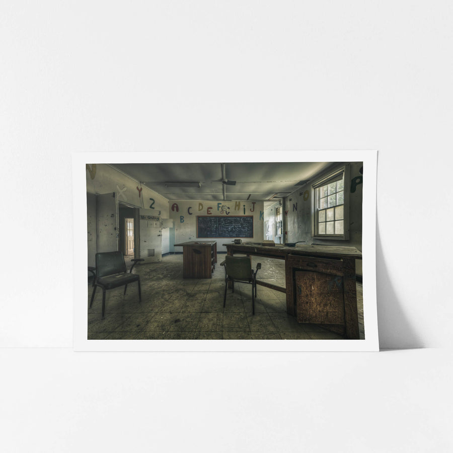 Electrical Workshop at The Asylum, a heavy timber workbench runs the length of the room, its surface scarred and darkened.